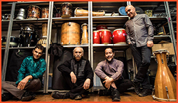 quartet of musicians with percussion instruments